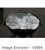 #10904 Picture Of Foil With Holes Covering A Rusty Bbq Grill