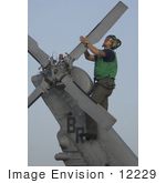 #12229 Picture Of A Soldier During Corrosion Maintenance On A Military Helicopter