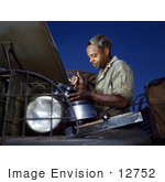 #12752 Picture of an African American Mechanic Working on an Air Filter by JVPD