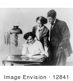 #12841 Picture Of Two Woman And A Man Reading A Book By A Lamp