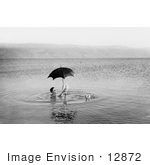 #12872 Picture of a Man Floating With Umbrella and Book in the Dead Sea by JVPD