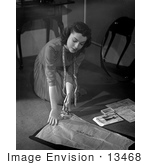 #13468 Picture Of A Woman Measuring And Cutting Clothing Materials