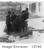 #13740 Picture of Men Pulling Annie E Taylor’s Barrel Out of the Water at Niagara by JVPD