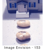 #153 Photo Of Wishing Stones In Front Of A Model House