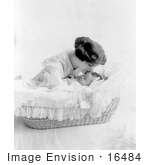 #16484 Picture Of A Mother Over A Bassinette Kissing Her Baby