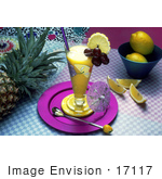 #17117 Picture Of A Fruit Drink Beverage In A Tall Clear Glass On A Table With Pineapple And Lemons