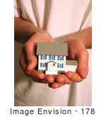 #178 Photo Of A Man Holding A Model House In His Hands