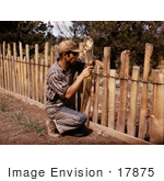 #17875 Photo Of A Homesteader And Farmer Repairing A Wooden Slab Fence