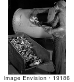 #19186 Photo Of A Male Factory Worker Putting Duds Back Into A Furnace For Recasting