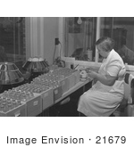 #21679 Stock Photography Of A Woman Labeling Bottled Vaccines In A Laboratory