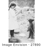 #27890 Historical Stock Photo Of A Litte Girl Holding Up A Donut To A Hungry Bear Cub That Is Standing On Its Hind Legs And Tied By A Chain