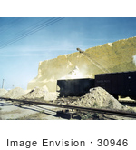 #30946 Stock Photo Of An Excavator Loading Railroad Cars With Scoops Of Sulphur From A Vat At The Freeport Sulphur Company In Hoskins Mound Texas