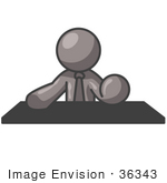 #36343 Clip Art Graphic Of A Grey Guy Character Sitting Behind A Desk