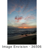 #36506 Stock Photo Of Pink Clouds Scattered In A Blue Sky Above A Deep Orange Sunset Over The Ocean From Poipu Kauai Hawaii