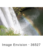 #36527 Stock Photo Of A Rainbow In The Mist Above The Pool At The Bottom Of The Wailua Falls Kauai Hawaii