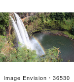 #36530 Stock Photo Of The Wailua River Forming The Wailua Falls As It Flows Over The Red Cliffs Into The Pool Below With A Rainbow Kauai Hawaii