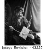 #43225 Rf Photo Of A Black And White Bedouin Man Playing A Rababeh Instrument