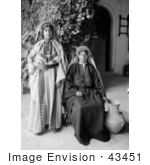 #43451 Rf Stock Photo Of Two Young Ramallah Women In Black And White One Sitting One Standing