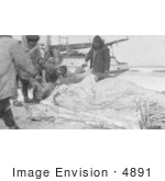 #4891 Eskimo Hunters Cutting Up A Walrus