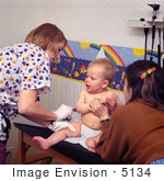 #5134 Stock Photography Of A Physician And An Assistant Administering A Hepatitis B Vaccination To A 9 Month Old Baby