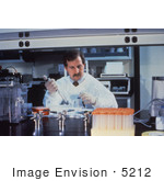 #5212 Picture Of A Lab Technician Pipetting Specimens While He Conducts Laboratory Research