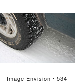 #534 Image Of A Tire On A Snowy Road