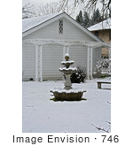 #746 Image Of A Birdbath In A Snowy Garden