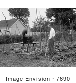 #7690 Stock Photography Of A Man Gardening And Listening To A Radio