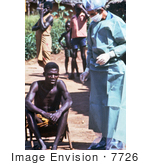 #7726 Picture Of Health Official Preparing To Give A Zairian Man An Ebola Exam