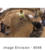 #9048 Picture Of Archaeologists Studying Human Remains