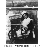 #9403 Picture of a Woman Using a Spinning Wheel by a Fireplace by JVPD