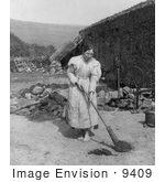 #9409 Picture Of A Woman Sweeping By A Spinning Wheel