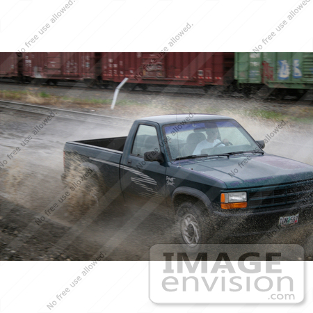 #10 Picture of Young Man Off-roading in a Pickup Truck by Kenny Adams
