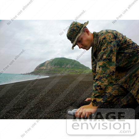 #10775 Picture of a Soldier Collecting Sand From Iwo Jima by JVPD