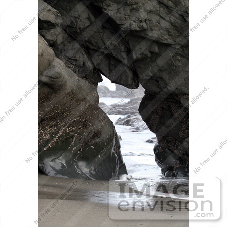 #1160 Picture of a Cave in a Rock at the Beach by Kenny Adams