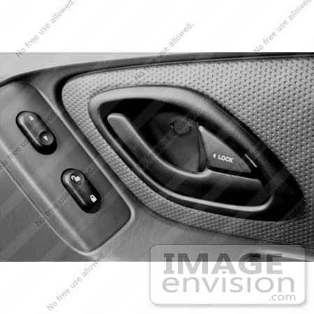 #12099 Picture of a Door Handle and Power Buttons in a Car by Jamie Voetsch