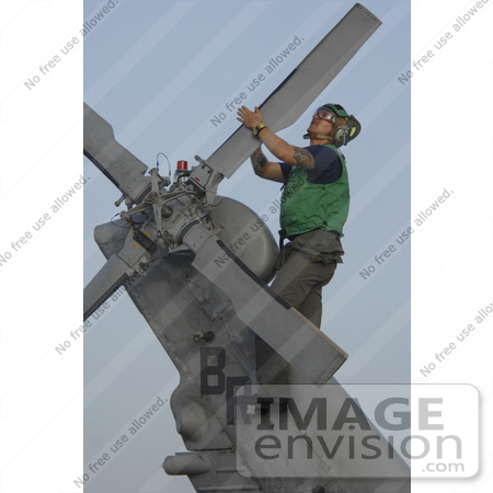 #12229 Picture of a Soldier During Corrosion Maintenance on a Military Helicopter by JVPD