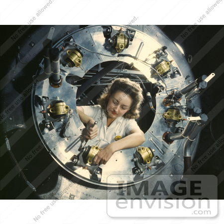 #1238 Photo of a Riveter Woman Framed by a Circular Opening of a Cowling, Working on Lower Section by JVPD