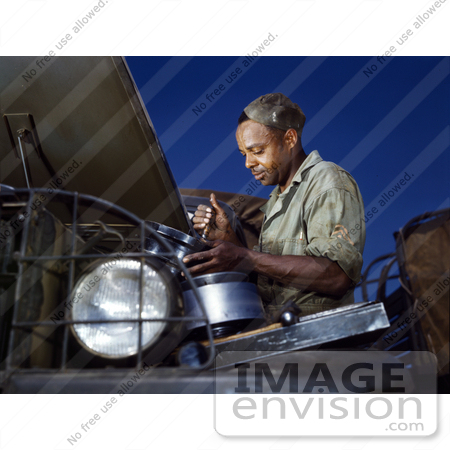 #12752 Picture of an African American Mechanic Working on an Air Filter by JVPD