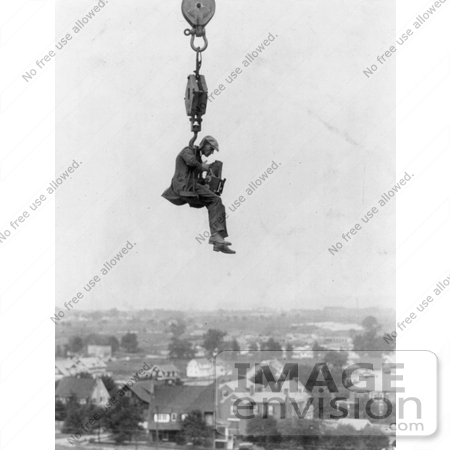 #12766 Picture of a Photographer and Camera Suspended Above a Town by JVPD