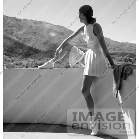 #13460 Picture of a Young Caucasian Woman in a Tennis Uniform, Sitting on a Balcony by JVPD