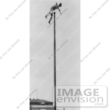 #13742 Picture of the Human Fly Balancing at the Top of a Flag Pole by JVPD