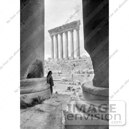 #13759 Picture of a Man Leaning on the Base of the Temple of Bacchus With a View on the Temple of Jupiter, Baalbek by JVPD
