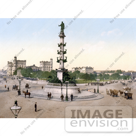 #16452 Stock Photo of People and Carriages Near the Admiral Tegetthof Statue in the Roundabout Street Near the Wien Nord-Praterstern Train Station in Vienna, Austria, Austro-Hungary by JVPD