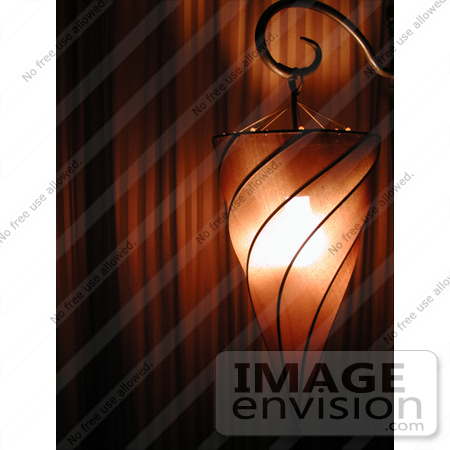 #165 Photograph of a Spiral Lamp in Front of Curtains by Jamie Voetsch