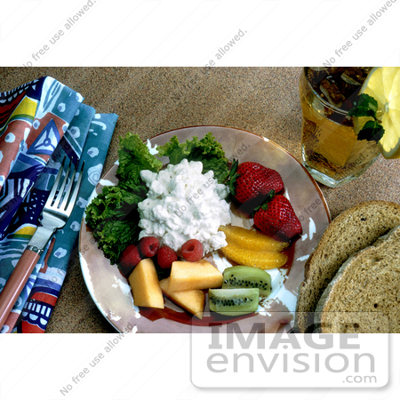 #17136 Picture of Cottage Cheese Served on a Plate With Strawberries, Oranges, Kiwis, Cantaloupe and Raspberries, With Two Slices of Wheat Bread and Iced Tea by JVPD