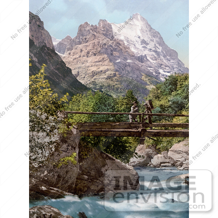 #18266 Photo of People on a Footbridge Over a River, View of Wetterhorn Mountain, Grindelwald, Bernese Oberland, Switzerland by JVPD