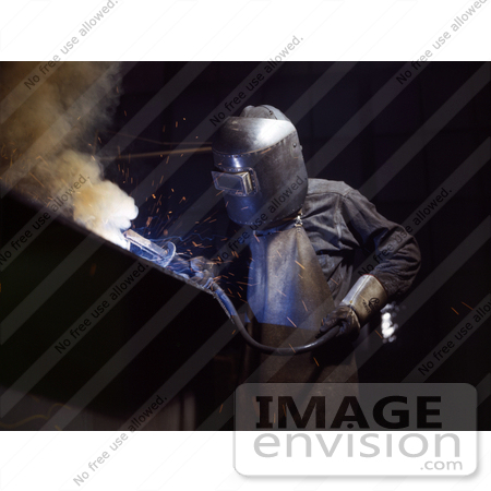 #19160 Photo of a Welder in Protective Clothing, Bending Over While Making Boilers by JVPD