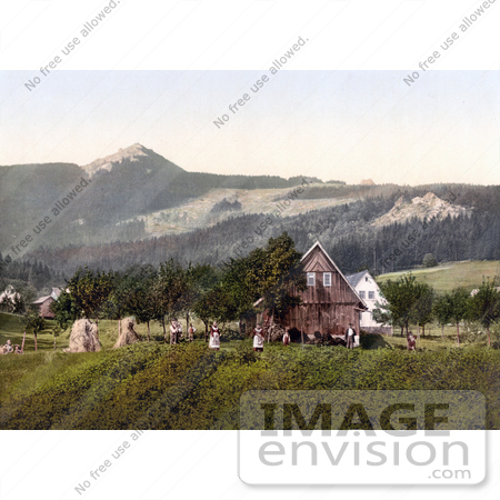 #19540 Photo of People Working Near a Barn With a View of the Jeschken Mountain in Liberec, Reichenberg, Bohemia, Czech Republic by JVPD