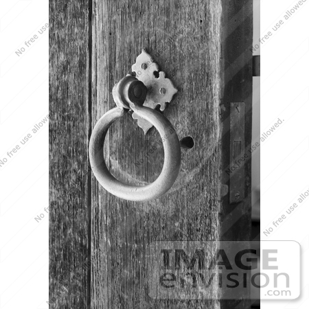 #20093 Stock Photo: Ringed Metal Door Knocker on a Wood Door by JVPD